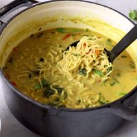 A delicious coconut curry broth loaded with veggies and ramen and topped off with fresh squeezed lime