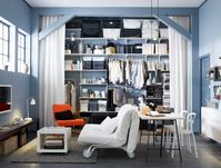 A wall of ALGOT shelving in a one-room home