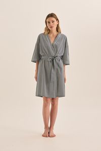 The Indigo robe in navy diamond by Gingerlilly. Indulge in comfort and elegance with our above-the-knee length robe, adorned in a delightful navy, small diamond pattern on white. This robe features three-quarter sleeves, a waist tie, and delicate white contrast piping for a touch of sophistication. Crafted from 100% cotton, it ensures breathability and comfort, perfect for year-round wear. Whether lounging at home or preparing for a restful night's sleep, this robe is a stylish addition to your