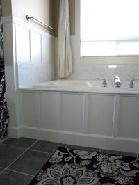 we updated our 90 s bathtub in one weekend with less than 200, bathroom ideas, diy, home decor, tiling, After we added carerra marble and wood paneling