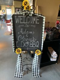 Recycled cardboard and some leftover chalkboard paint becomes quick, easy & inexpensive  repurposed “Welcome” sign for BBQ Rehearsal Dinner.