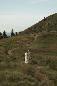 This romantic Roan Mountain couples photo session was filled with so many candid engagement poses and outdoor photoshoot poses! Find mountain couples photography, 90s couples photos, engagement photo ideas and film style engagement photography. Visit stratmanimagery.com to book Lauren for your intimate couples session or North Carolina engagement session!