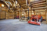 Equipment storage barn using hammer trusses.  www.sandcreekpostandbeam.com https://www.facebook.com/SandCreekPostandBeam