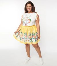 This sweet mini skirt, in collaboration with Looney Tunes, is crafted in a bright yellow fabric that boasts an adorable border print of multicolor florals and Bugs Bunny. Cinched with a side zipper as the gathered silhouette dances high above the knees.