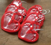 I love these!!! We can make newborn baby girl footprint salt dough ornaments and then give them for Christmas....works great for us since she will be here by Valentine's........