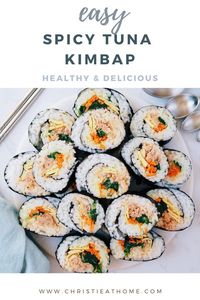 Spicy Tuna Kimbap. This popular tasty Korean nori wrapped roll contains spicy tuna, spinach, egg, carrots and seasoned rice. It's perfect for lunch, dinner or as a side. #koreanfood #koreanrecipe #kimbap