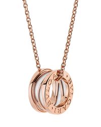 BVLGARI charm necklace. Polished 18-karat rose gold. Sliding white ceramic charm. Spiral center with engraved sides. Adjustable; lobster clasp. Made in Italy.