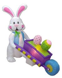 The Holiday Aisle 4' - 6' Long Easter Inflatable Rabbit Pushing Wheelbarrow with Eggs