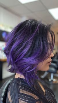 Add a splash of drama with purple chunky highlights, perfect for a bold and vibrant hair transformation. These highlights create a striking contrast and are sure to make your hairstyle stand out. Click the pin and follow us for more daring hair color ideas! #HairGoals #PurpleHighlights #ChunkyHighlights #BoldHair #HairInspo