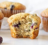 Easy Gluten-Free Blueberry Banana muffins that are dairy-free, nut-free, and have a vegan and refined sugar free option.