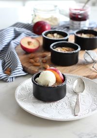 Make this plum frangipane dessert with tangy plums, sweet almond filling and crunchy topping. An easy gluten-free fall treat baked and served in ramekins. Get the recipe on the blog! Ramekin Desserts - Plum Dessert - Fall Dessert Recipes