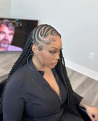 Pulled Back Dreadlocks  A woman with her hair pulled back in stylish dreadlocks against a wall background. Casual or Fashionable outings