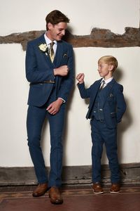 Wedding suit tick! Smart & timeless this men's and children's blue tweed suit is the ideal choice for heritage weddings. The Dion suit is made for grooms with its soft lapis blue tone and champagne trims. It has been created with meticulous craftsmanship using a herringbone weave and the added wool content lends a hand to durability and comfort. This heritage three piece will ensure all eyes are on you on the big day. Features Herringbone Slim fit Single-breasted Notch lapel Single back vent Fou