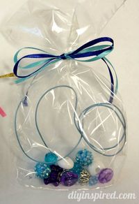 Several Frozen Birthday Party Ideas - Anna and Elsa Make Your Own Necklace Kit Party Favors