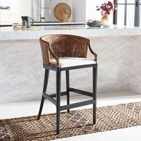 Inspired by the secret hideaways in exotic locales, the Brando Barstool is a nod to the art and adventure of imbibing. Sleek lined black mahogany legs beautifully support Brando’s richly textured brown rattan back while its clean white cushion ensures hours of comfortable glass clinking.