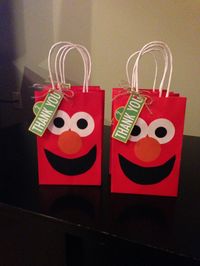 Elmo party favor bags for an Elmo party! I wonder if there would be a way to make a panda face on a white bag???