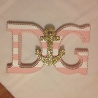 Create beautiful Greek Life letters that are one-of-a-kind! Just paint wooden letters from a craft store, glue on pearls, and add on your sorority's symbol (and don't forget the glitter!). #greeklife #deltagamma #anchor #dg