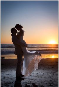 Love my wedding photo with the sunset in the background on the beach. Just be careful of your groom is wearing expensive shoes! Ocean water and leather isn't a good mix.