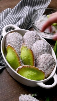 These Pandan Coconut Madeleines are delicious bite-sized light sponge cakes infused with pandan, brushed with glaze, and dipped in desiccated coconut. They are the perfect teatime treat.