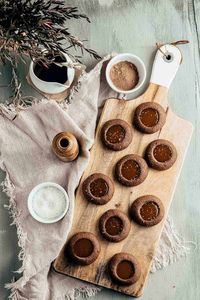 Made with chocolate shortbread dough and homemade caramel sauce, these Caramel Chocolate Thumbprint Cookies are a delicious holiday treat. They're the perfect balance of sweet and salty, guaranteed to be a hit among family, friends, and coworkers. Perfect for cookie trays too!