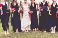 Navy blue twobirds ballgowns and bright flowers | A real wedding featuring our multiway, convertible bridesmaid dresses | Image by www.annaclarkphotography.com