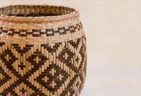 Perhaps the best-known handicraft of the Cherokee are their river cane, white oak, and honeysuckle baskets. Traditionally, these baskets were boiled with black walnut or native bloodroot to produce darker colors, yet just as often they were left in the rich yellow hue of the natural cane.