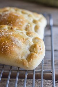 Homemade Calzones - Warm, soft pockets of pizza dough stuffed with Italian sausage, marinara, and mozzarella cheese.