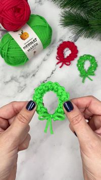 For a quick and easy crochet ornament simply work a Romanian cord, using your favorite chunky yarn, tie both ends together and you have an adorable mini wreath. If you want to be a little extra, add a couple of beads.