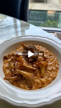 Amber Bastian ANutr on Instagram: "Nduja risotto 🌾 

Serves 2
You will need…
* 1 tbsp EVOO
* 1 onion, finely diced
* 2 garlic cloves, minced
* 50g Nduja paste
* 150g risotto rice
* 100ml white wine
* 500ml chicken stock
* 1/2 lemon
* 15g parmesan
* 2 tbsp crème fraiche
* 100g girolle mushrooms, pan fried (optional)

1. Heat the EVOO in a large pan, add the onion and fry for 5-10 mins until nice and soft.
2. Add the garlic and fry for 1-2 mins, stirring frequently.
3. Stir in the Nduja, followed by the rice, and mix well.
4. Add the wine and stir continuously until most of it has evaporated.
5. Add the stock, a ladle at a time, and stir frequently until the rice has absorbed most of it. Add another ladle of stock, and repeat the process until the rice is cooked.
6. Stir in the lemon juice,