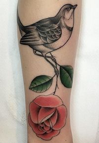 Mariusz Trubisz rose flower and bird tattoo