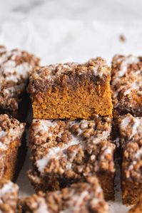 Pumpkin season is here to stay with this moist pumpkin coffee cake with a crumb topping and decadent cream cheese glaze. YUM!