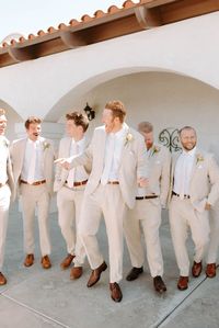 This groom is sporting a neutral tan suit with a navy tie for his summer wedding in Camarillo, California! Come see more groomsmen outfit trends, groom suit ideas, groomsmen style, california wedding venues, palm springs wedding venues, outdoor wedding venues in california, fall wedding inspiration, fall wedding ideas, and 2023 wedding trends. Book Kate for your luxury southern california wedding at kategarciaweddings.com!