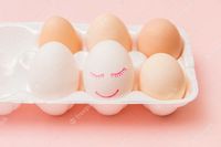 Premium Photo | White chicken egg with painted face and smile in pink egg box. happy easter concept