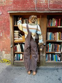 outdoor bookstore, boston fall vibes, northeast fall aesthetic, boston bookstore, free people overalls, fall outfit inspo, fall fashion trends 2024, chunky sweater, fall photo inspo, prefall fashion ideas