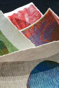 An assortment of stitched paper collages are included in a post about Karin Lundstrom's colorful embroidery.