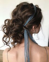 aesthetic hairstyle of a female girl blue ribbon