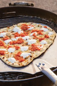 We use just a tiny amount of yeast and a high percentage of water to ensure pizza dough that easily stretches and cooks up thin when grilled.