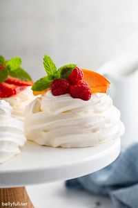 Pavlova is an easy dessert with a crisp exterior and soft marshmallow-y inside. Filled with whipped cream and fresh fruit, it's elegant and beautiful!