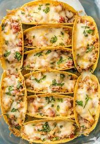 SUPER EASY Oven Baked Spicy Chicken Tacos make a weekly appearance on our table. All the flavor and none of the stress. ALL THAT MELTED CHEESE! Perfect recipe for a crowd on Family Mexican Night!