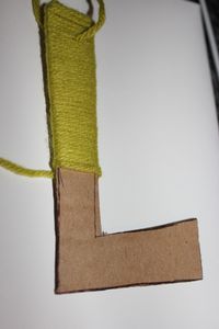 Cardboard and yarn! wow too cute and easy... and cheaper than buying the wood letters