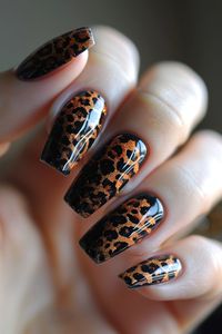 Leopard print with tiny seashell decals scattered across the nails.