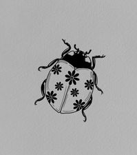 floral lady bug tattoo