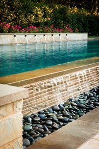 Love the retaining wall with fountains around the pool