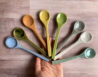 "This listing is for ONE individual spoon. Please specify desired quantity and color at check-out. Each of these spoons are hand sculpted, no two are completely alike! Their irregularities are what makes them so charming and unique. Sure to make any mixing or serving occasion extra special! Food, dishwasher and microwave safe. Back sides are intentionally left unglazed.  Each spoon measures approximately 6\" long."