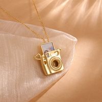 Custom Camera Necklace with Photo Picture Inside, Gift For Camera Lover, Gift for Her Mom, Grandma, Memorial Jewelry, Anniversary Gifts ▶ Custom Camer Locket Necklace Gift for Her This camera locket necklace with a rectangle insert for a customizable photo, ideal as a meaningful gift for various special occasions and recipients: ❤ Engagement Gift: Capture the moment with a photo of the proposal inside the locket, symbolizing the beginning of a lifelong journey together. ❤ Wedding Gift: Commemora