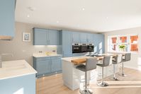 Blue and cashmere shaker style kitchen combined with large kitchen island