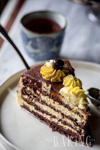 The best chocolate cake recipe made with a moist chocolate sponge cake in between a creamy custard buttercream.