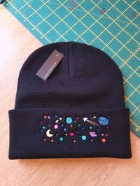 Custom made to order space scene solar system embroidered winter hat Available in beanie or bobble hat. Made in black but if you prefer another colour drop me a message