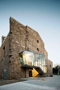 This neglected church, once part of the Sant Francesc Convent, was renovated by Catalan architect David Closes. Located in the town of Santpedor, Spain, it was the last building standing from the convent and was badly in need of repair. The project turned the former church into an auditorium and multifunctional space for cultural events.