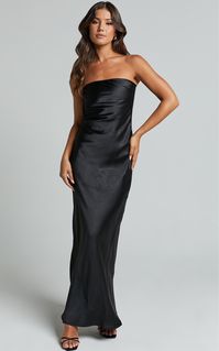 Our Charlita Dress is serving refined glamour and we're totally here for it! This sumptuous full-length number has a sleek strapless silhouette, draped cowl back feature and satin-like finish. It's a timeless and elevated piece that will suit so many special events - from formals to weddings. Style it with drop earrings and high heels to bring the look together! Product Details  Button fastening at back Inner rubber grip tape on neckline Open cowl back feature Bias cut silhouette Shiny satin fin